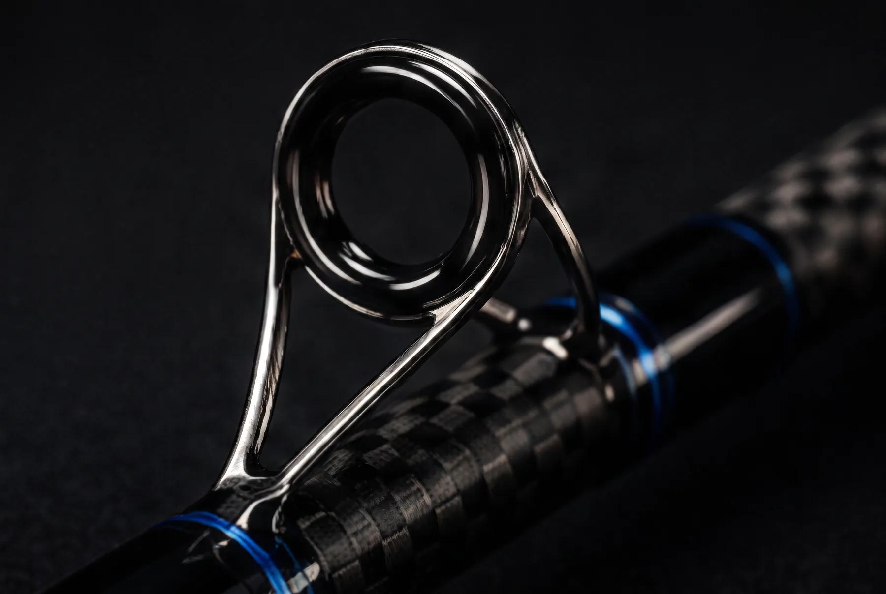 Close-up of a single hand-aligned guide bonded to a telescopic carbon section