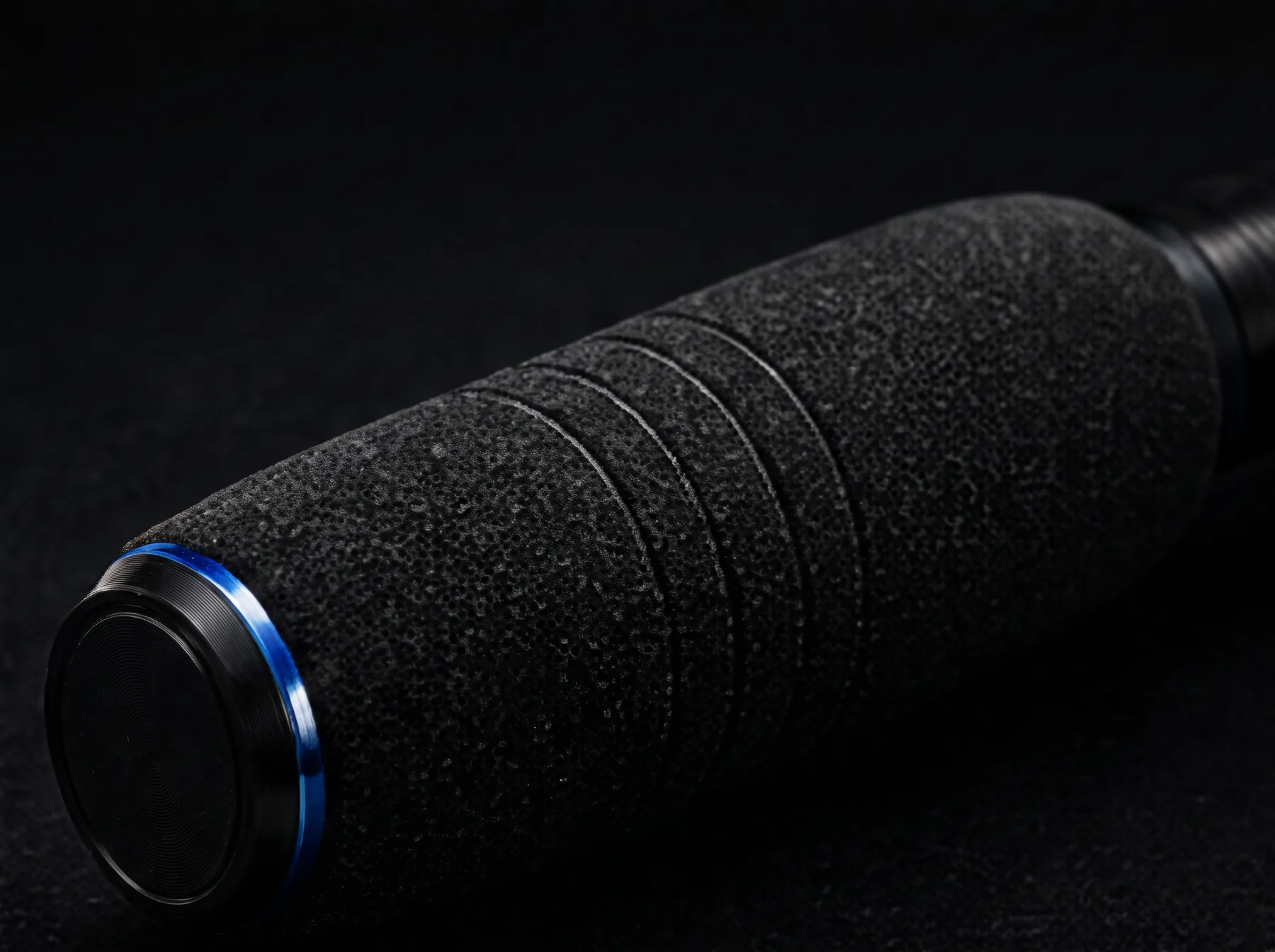 Textured grip with machined end cap and blue anodised ring