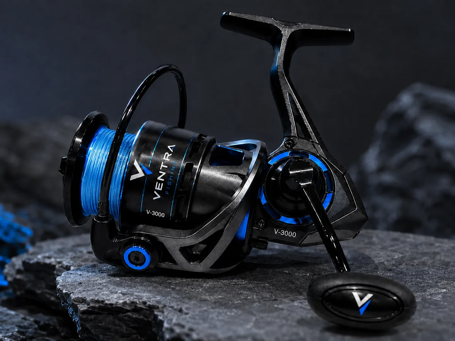 V-3000 spinning reel loaded with blue V-BRAID, resting on a wet rock ledge